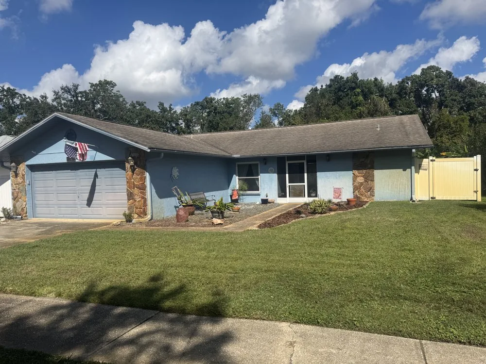 Front yard of a home with a maintained lawn